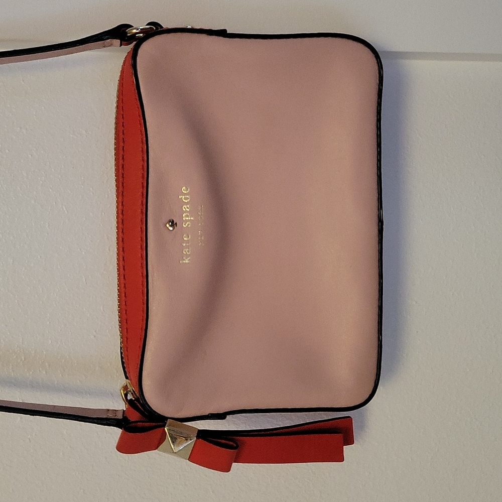 Kate Spade New York crossbody bag.  Small material flaw shown on last photo